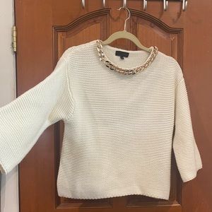 BEAUTIFUL SWEATER WITH GOLD DETAIL ON THE NECKLINE.lightly used